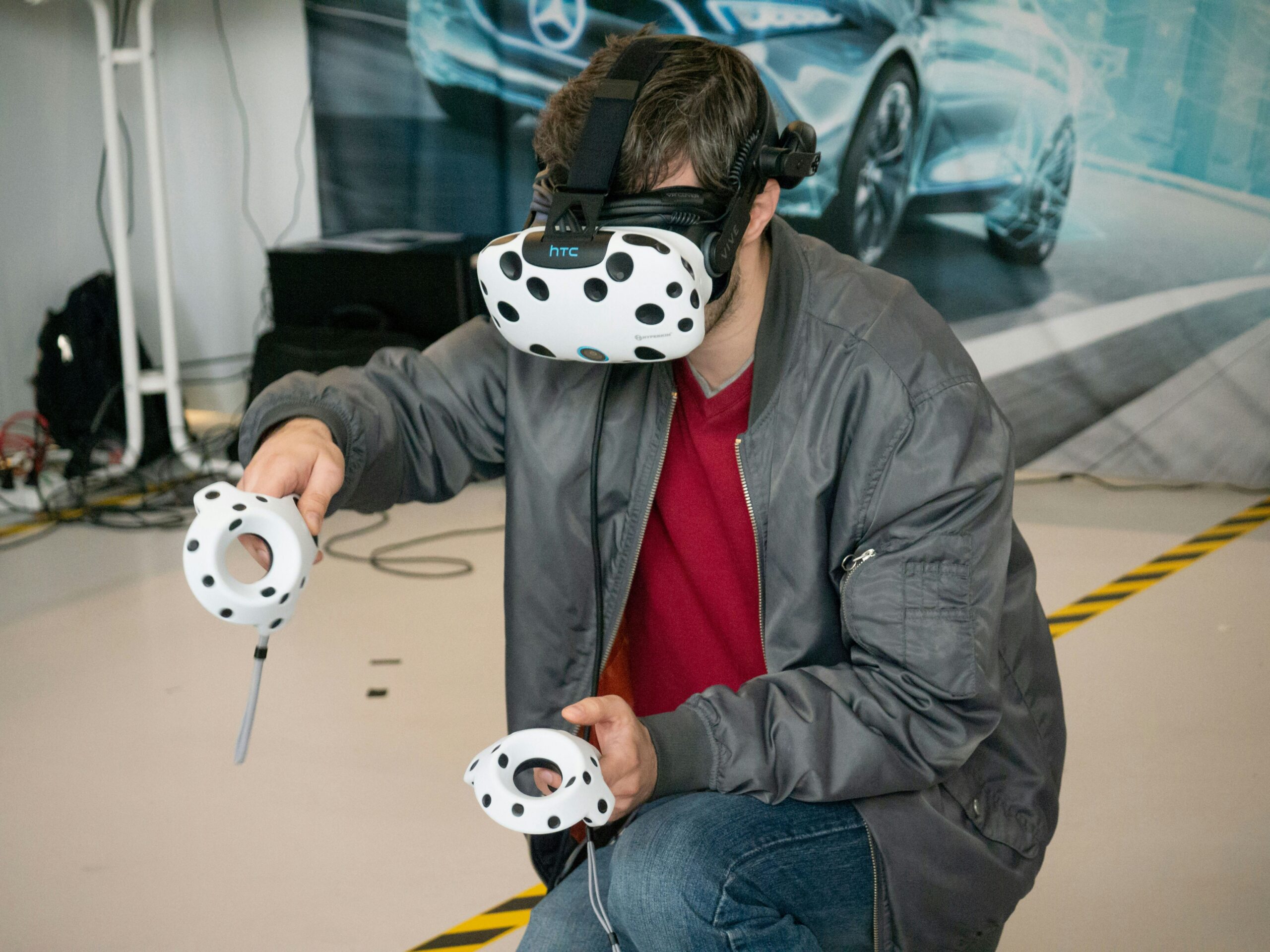 man in black jacket and blue denim jeans with white and black panda mask