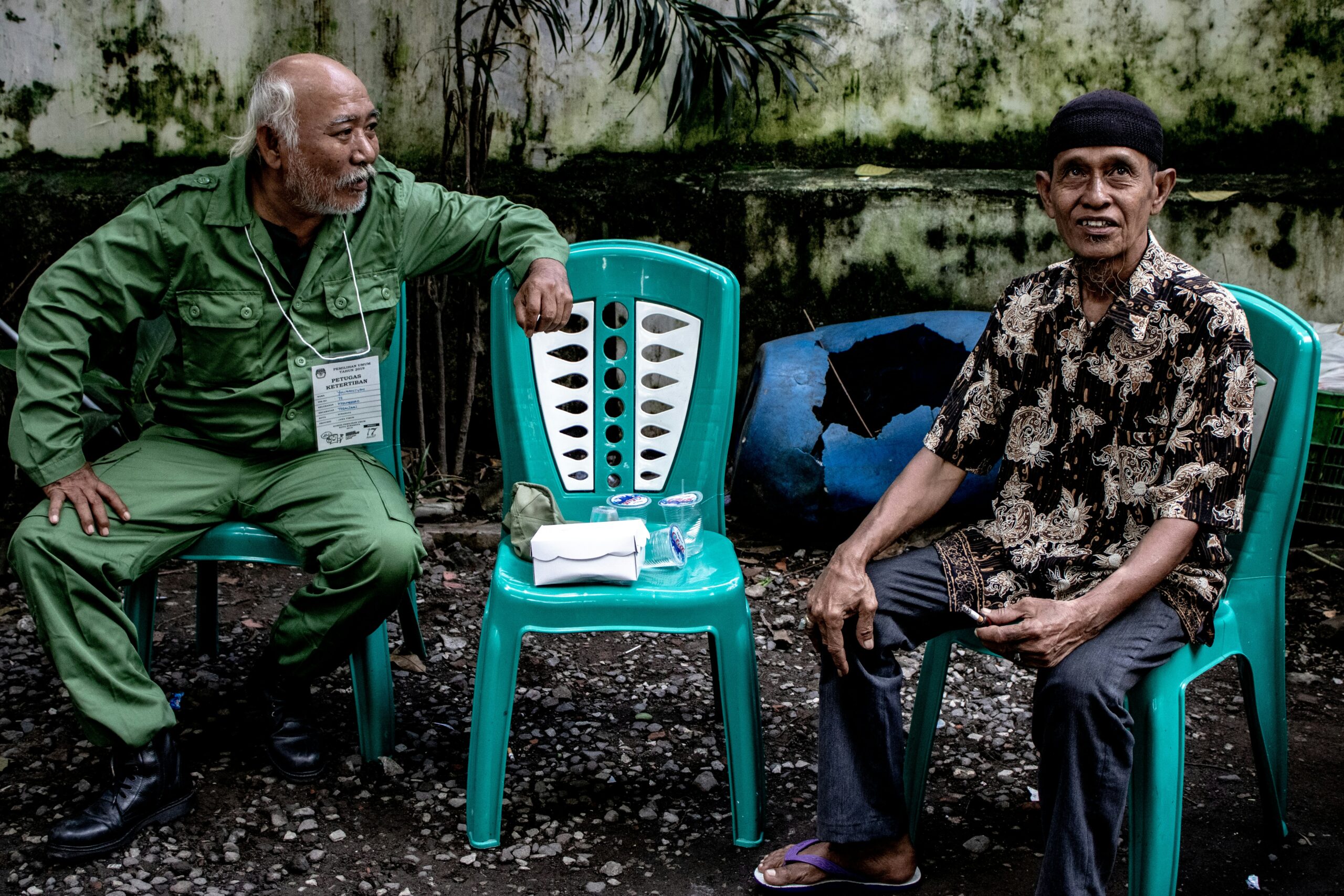 two man sitting on chairs